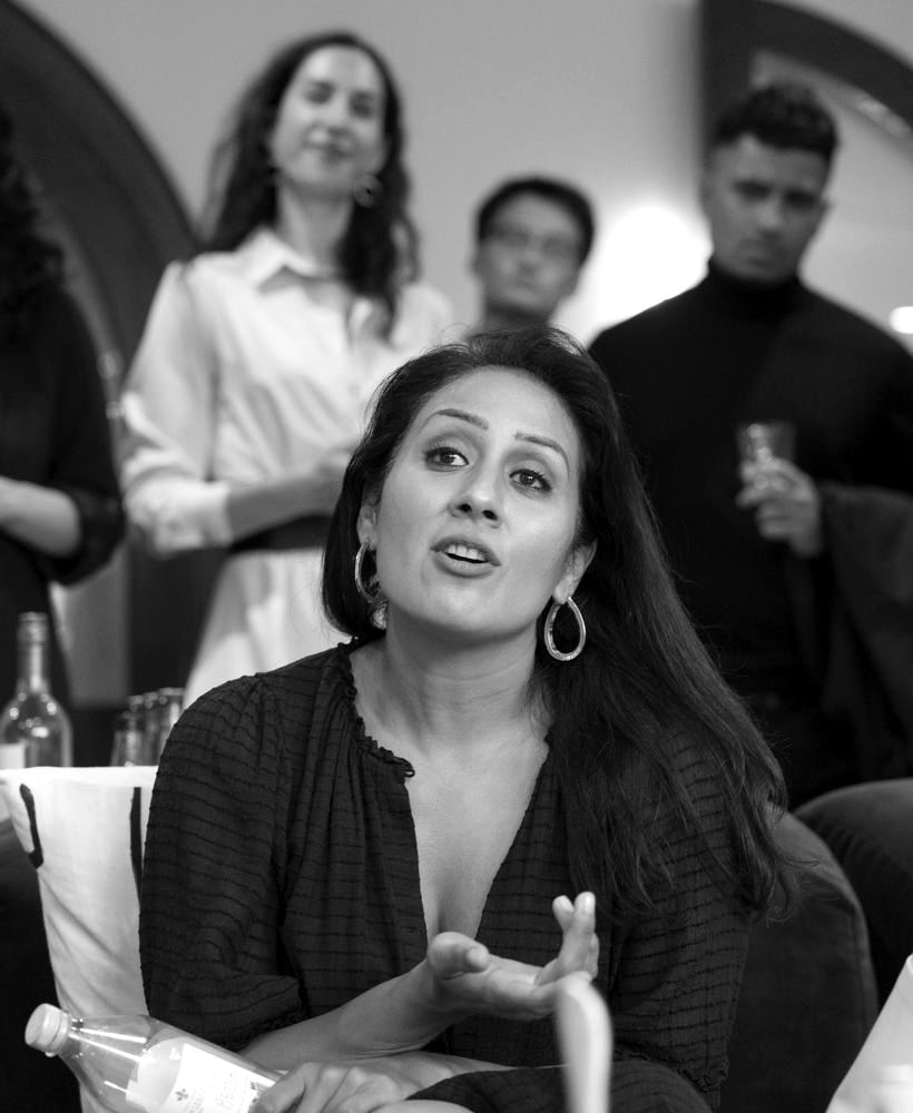 Mona Patel speaking with a room of leaders